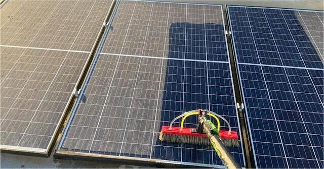 Clean solar panels on a residential roof under a blue sky